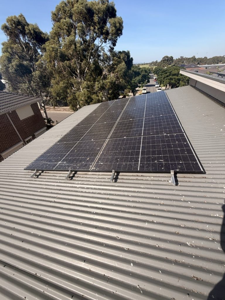 Solar panels covered in pigeon droppings on a Melbourne roof before bird proofing